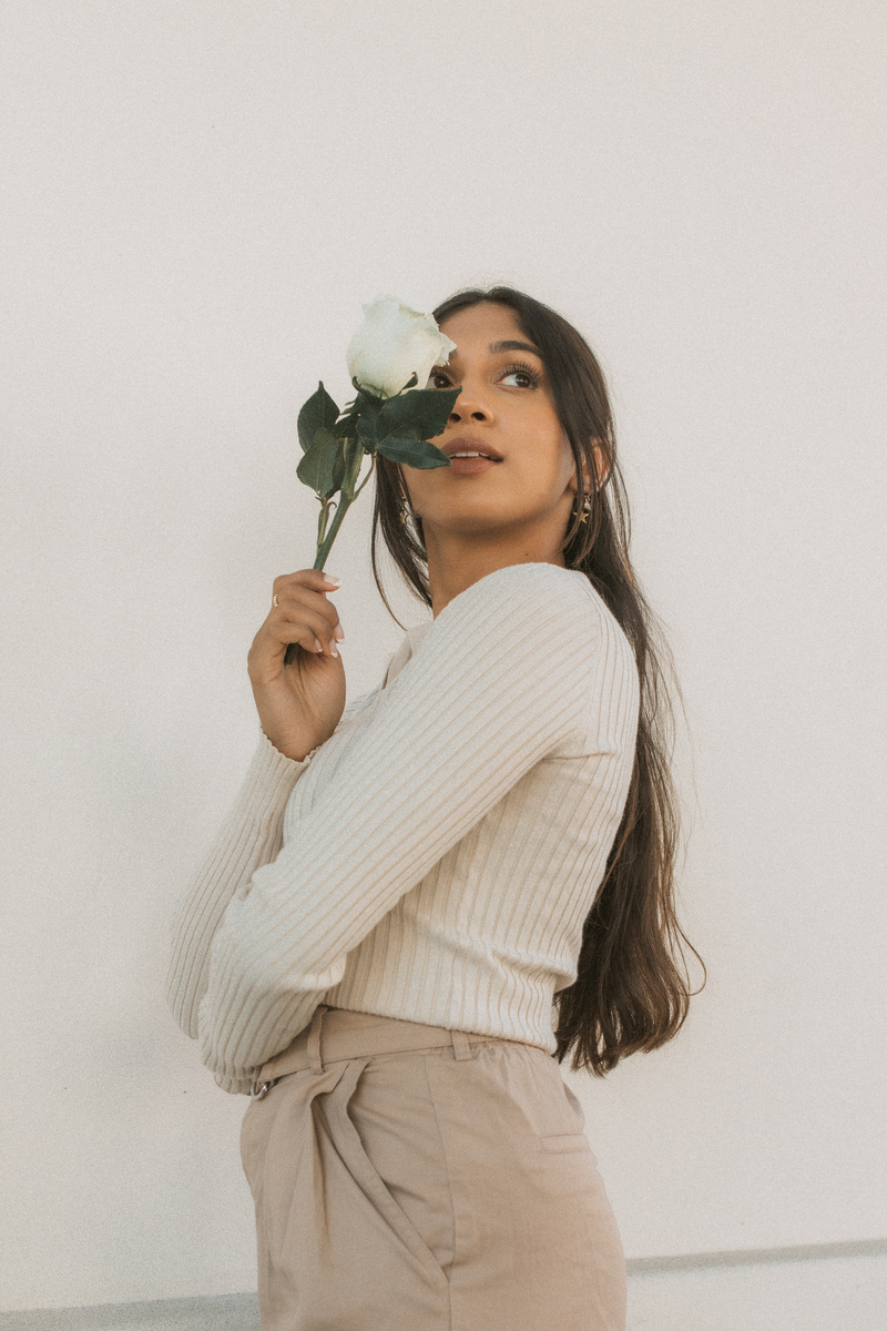 Woman Holding a White Flower